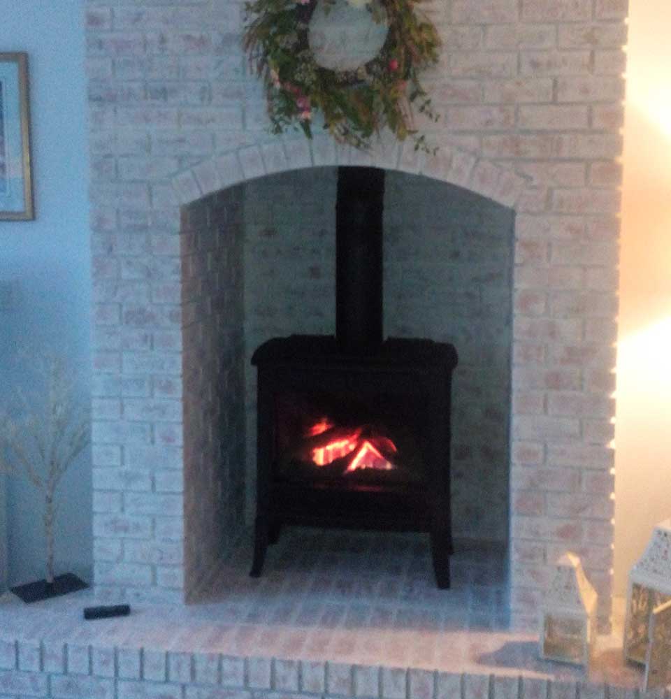Huttons red brick fireplace turned to pink after