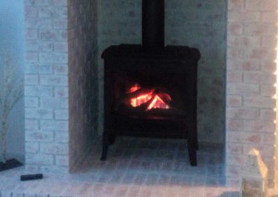 Huttons red brick fireplace turned to pink 170527 after Hutton’s Interior Decorating